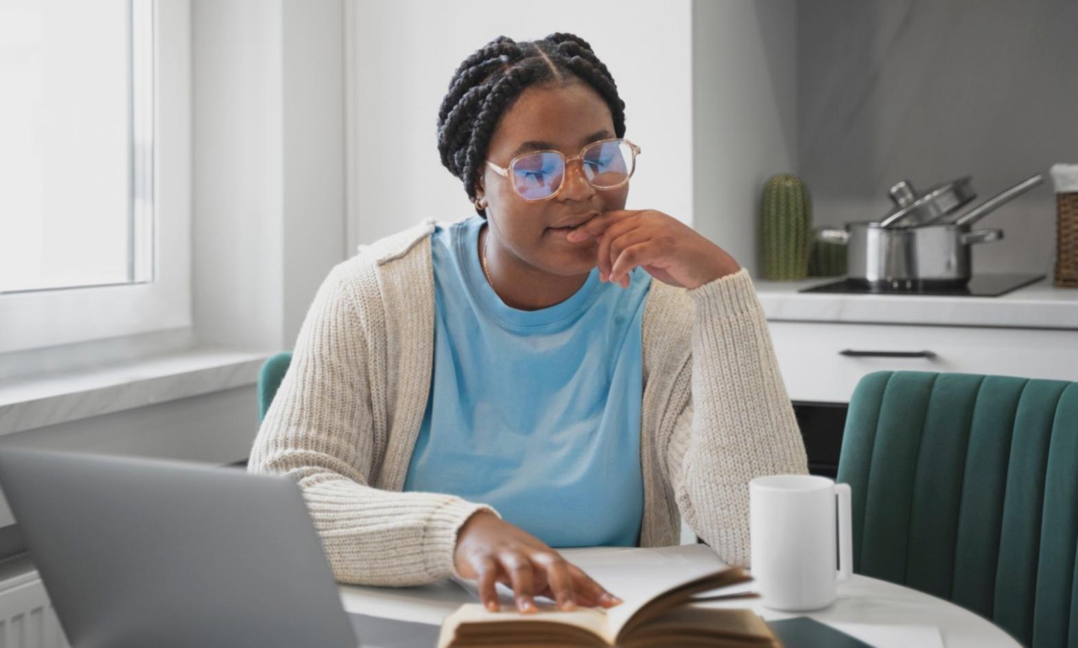 Financial analyst reviewing company reports and data charts
